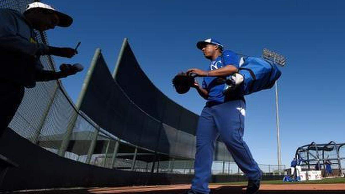 
Royals catcher Salvador Perez stopped to sign an autograph during Sunday's spring training workout in Surprise, Ariz.
