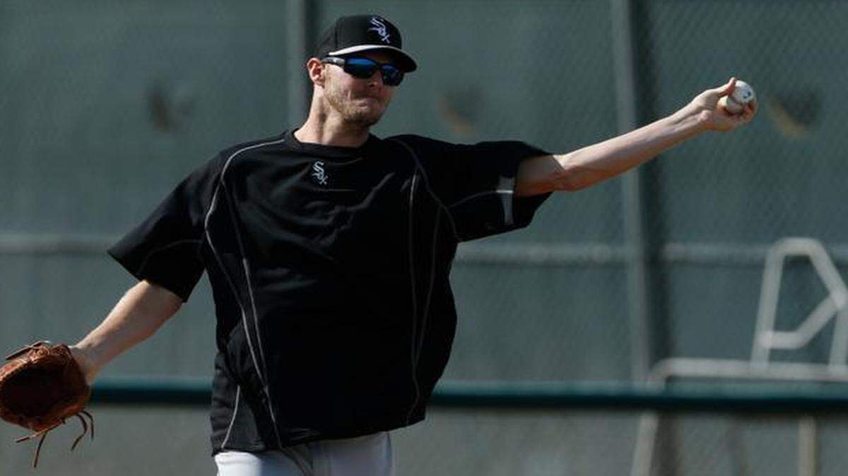 
White Sox pitcher Chris Sale throws a ball during a spring training baseball workout last Saturday in Phoenix.
