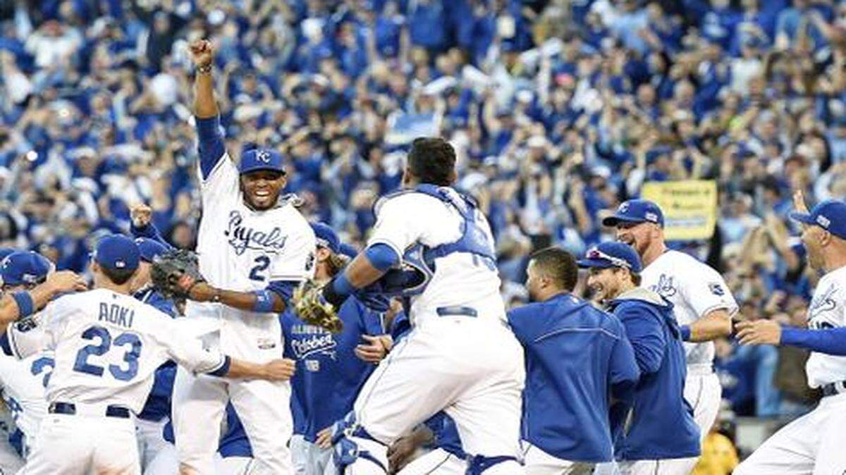 
The team rushed the field and surrounded Royals shortstop Alcides Escobar (2) as he pumped his fist in celebration of claiming a berth in the World Series on Oct. 15, 2014, at Kauffman Stadium after the Royals beat the Orioles 2-1.

