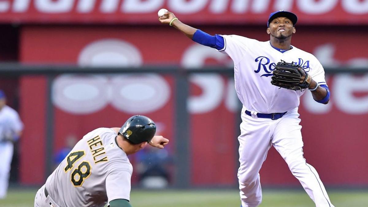 Kansas City Royals shortstop Alcides Escobar turned a double play over Oakland’s Ryon Healy during a game last season.