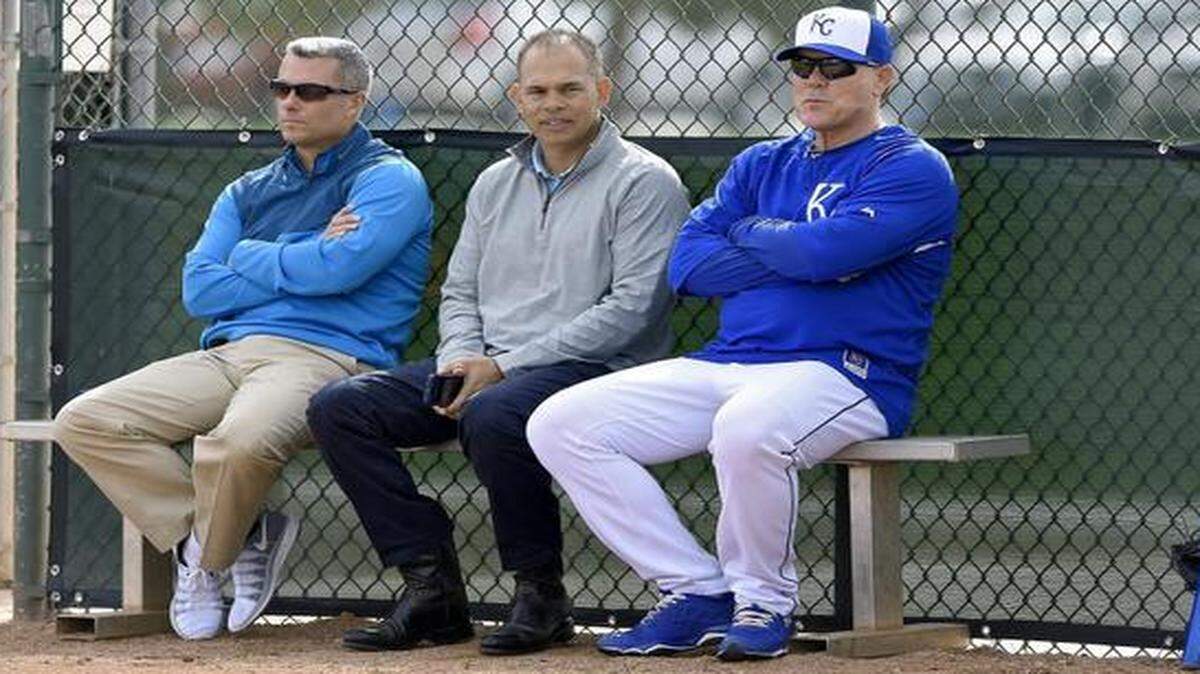 
Kansas City Royals general manager Dayton Moore (left) watched a spring-training workout with assistant general manager Rene Francisco (center) and manager Ned Yost in February.
