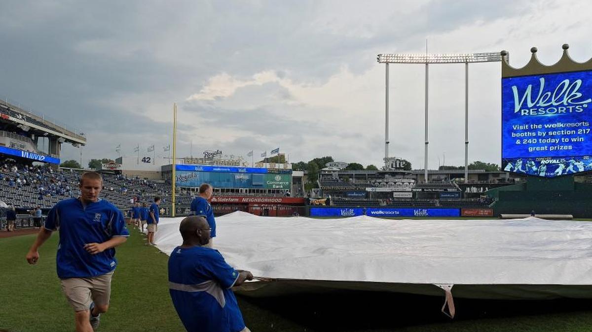 
The Kansas City Royals groundscrew covered the field as rain began to fall, causing a delay in the start of Thursday’s baseball game against the Baltimore Orioles.
