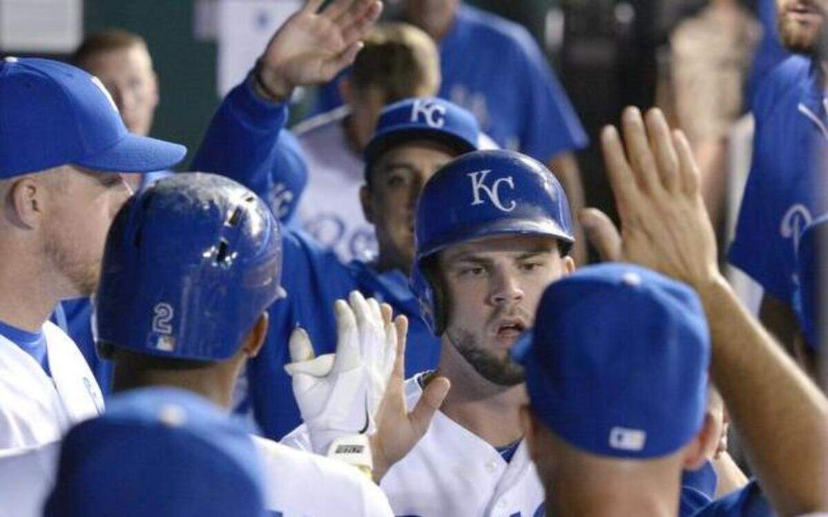 
The Royals’ Mike Moustakas was greeted after scoring on a sacrifice fly by Alcides Escobar in Tuesday’s game against the Oakland Athletics.
