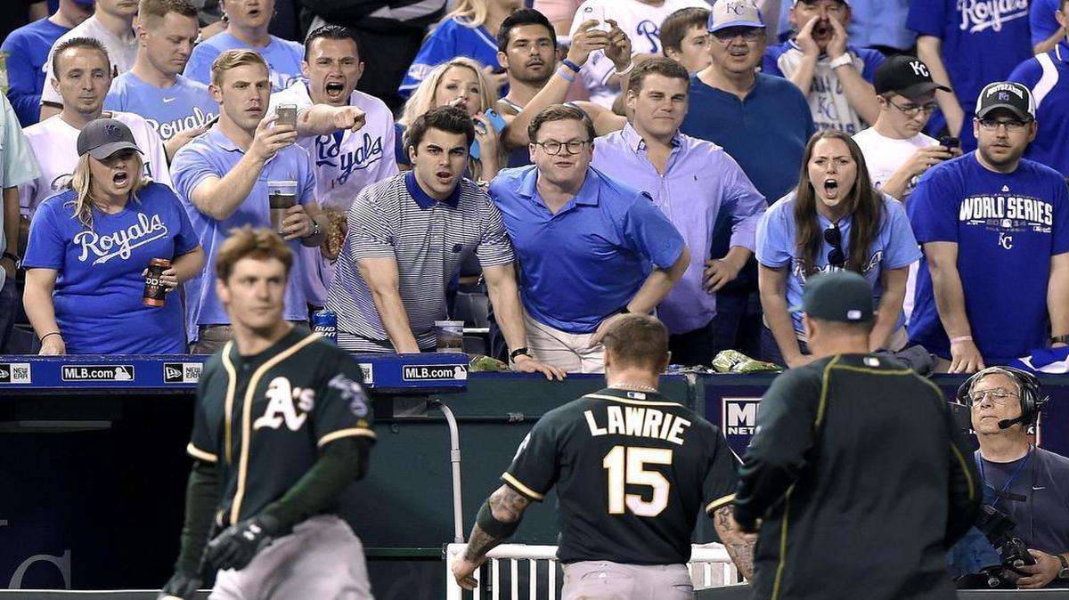 
Kansas City Royals fans yelled at Oakland Athletics' Brett Lawrie as he left the field after being forced out at second by shortstop Alcides Escobar, who ended up leaving the game with an injury in the seventh inning during a game in April.
