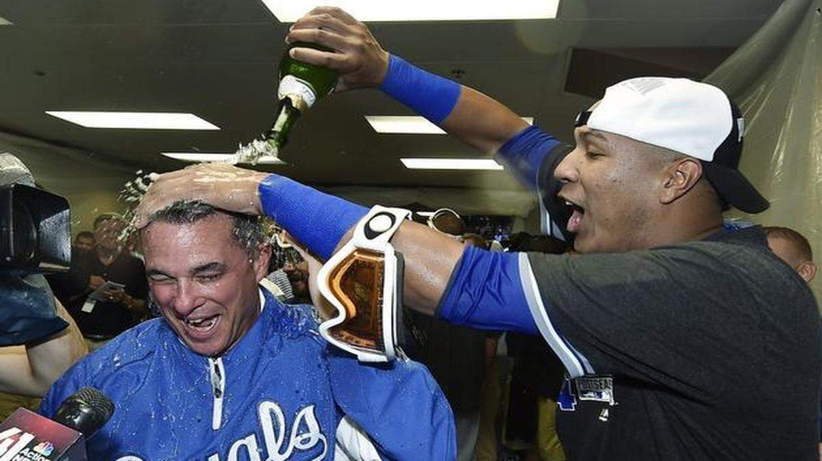 
Kansas City Royals’ general manager Dayton Moore was doused by Salvador Perez after the Royals made the playoffs last year.

