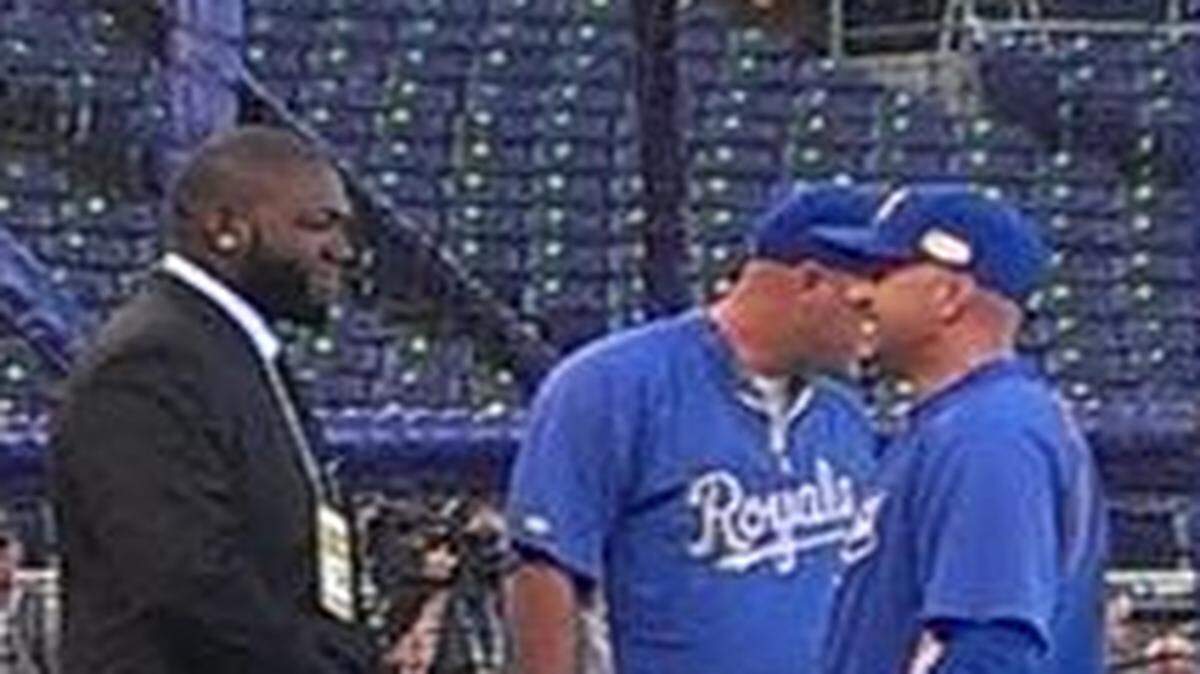 
David Ortiz (left) talked to Royals players and coaches before game one of the World Series on Tuesday.
