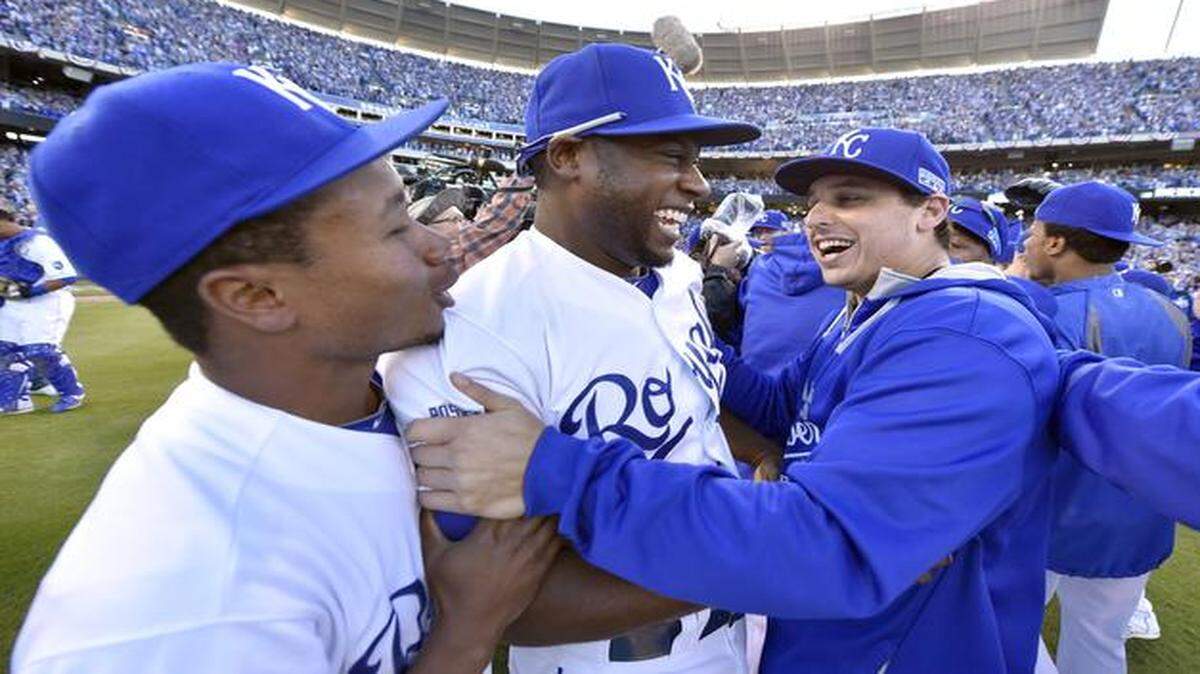 
Royals pitcher Yordano Ventura (left) and Jason Vargas gave ALCS MVP Kansas City Royals center fielder Lorenzo Cain a big hug after the Royals beat the Orioles on Wednesday, winning the ALCS.


