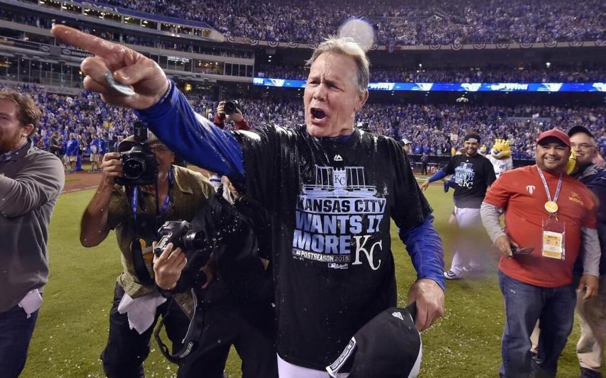 Kansas City Royals manager Ned Yost yelled to catcher Salvador Perez after he was soaked with the water bucket after the Roytals won their ALDS against Houston.