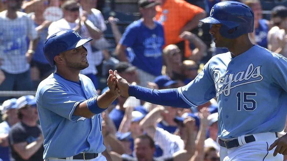 
The Royals’ Omar Infante (left) and Alex Rios celebrated after scoring during a game in July.
