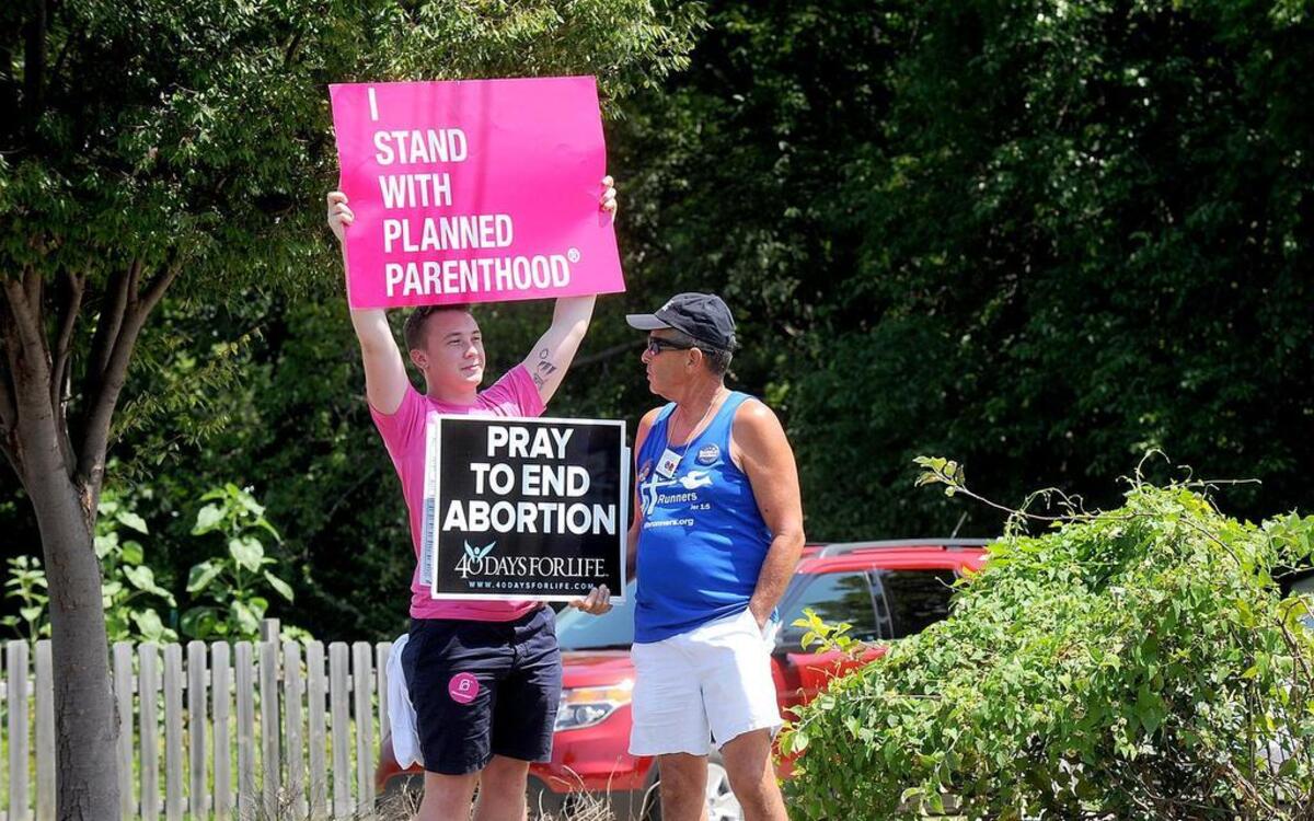 
Demonstrators exhibit clashing views outside the Planned Parenthood clinic in Columbia.
