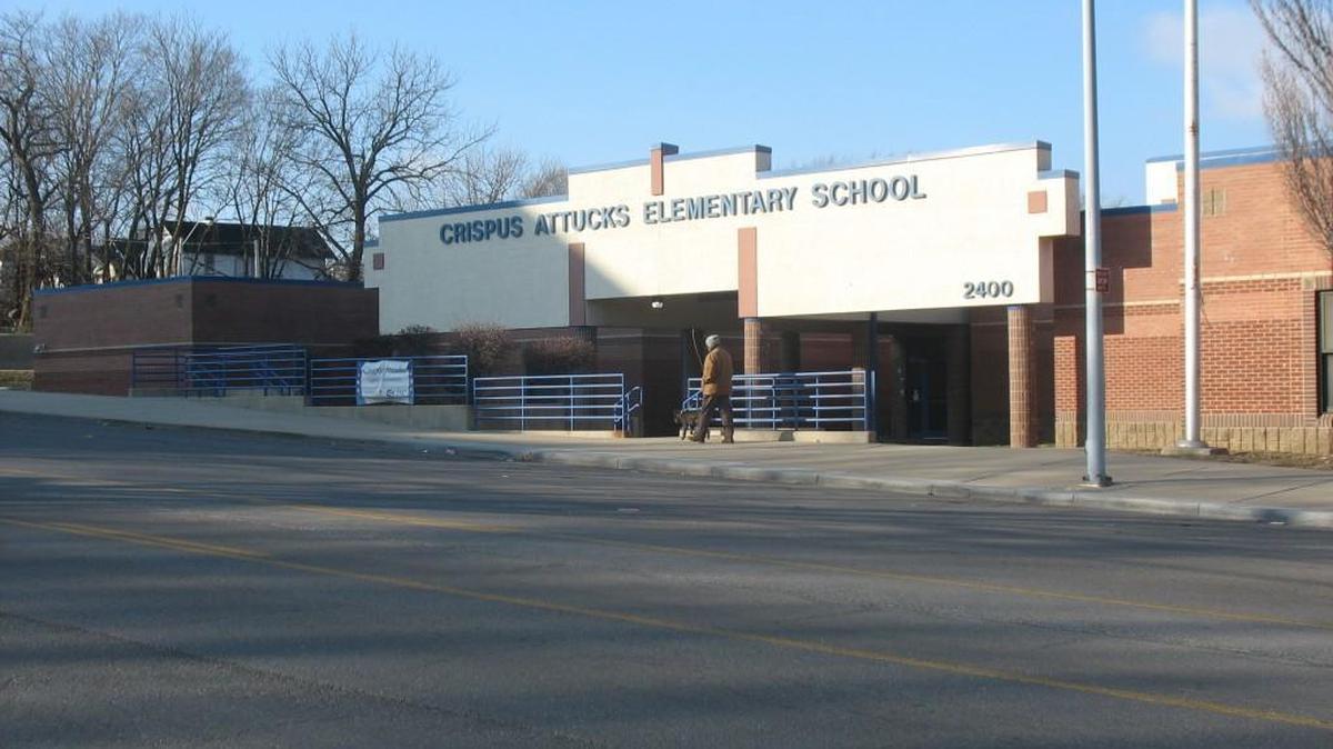 Crispus Attucks Elementary School is to remain open in the new Kansas City Public Schools master plan and take in students from Wendell Phillips Elementary School, which is to close.