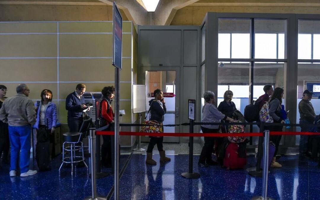 Holiday season passengers lined up for security checks at Kansas City International Airport.