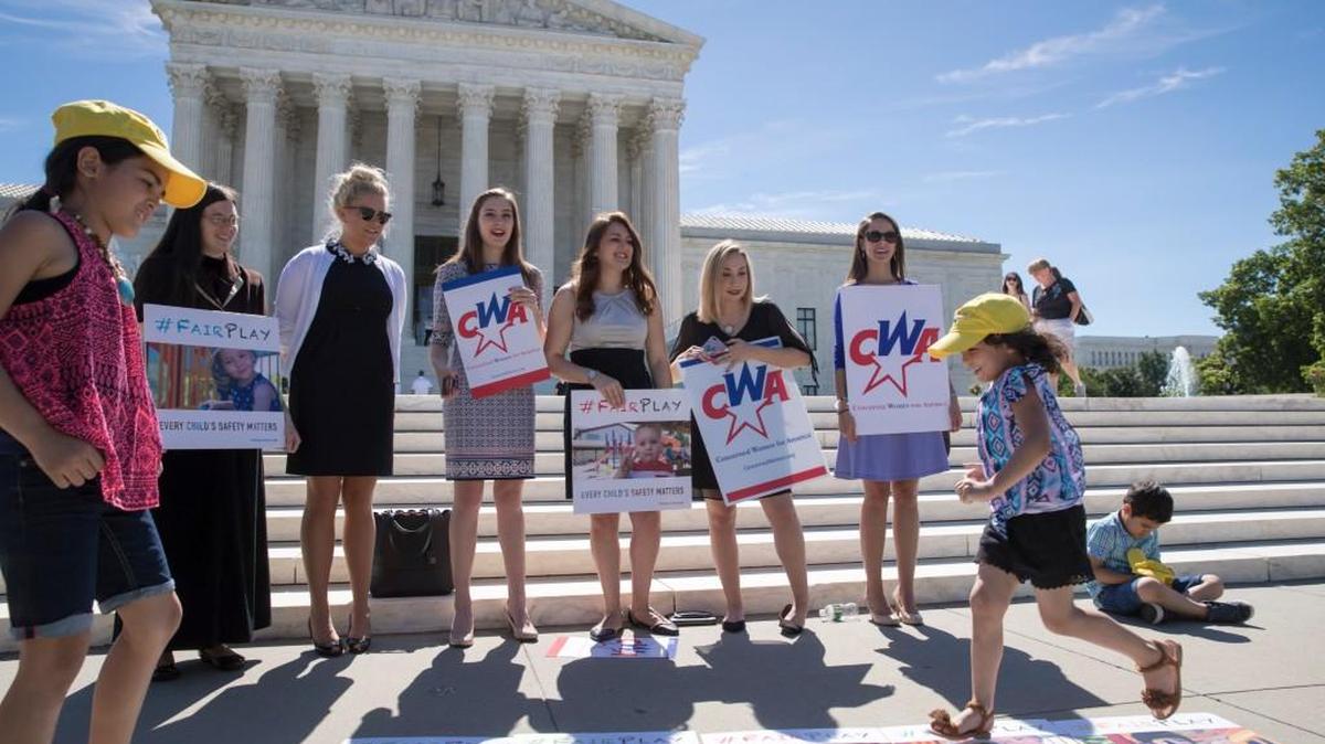 On the final day for rulings at the Supreme Court, a group from the Concerned Women for America, a Christian women’s activist group, shows their support as the justices ruled 7-2 for Trinity Lutheran Church of Columbia, Mo., that churches have the same right as other charitable groups to seek state money for new playground surfaces and other non-religious needs.