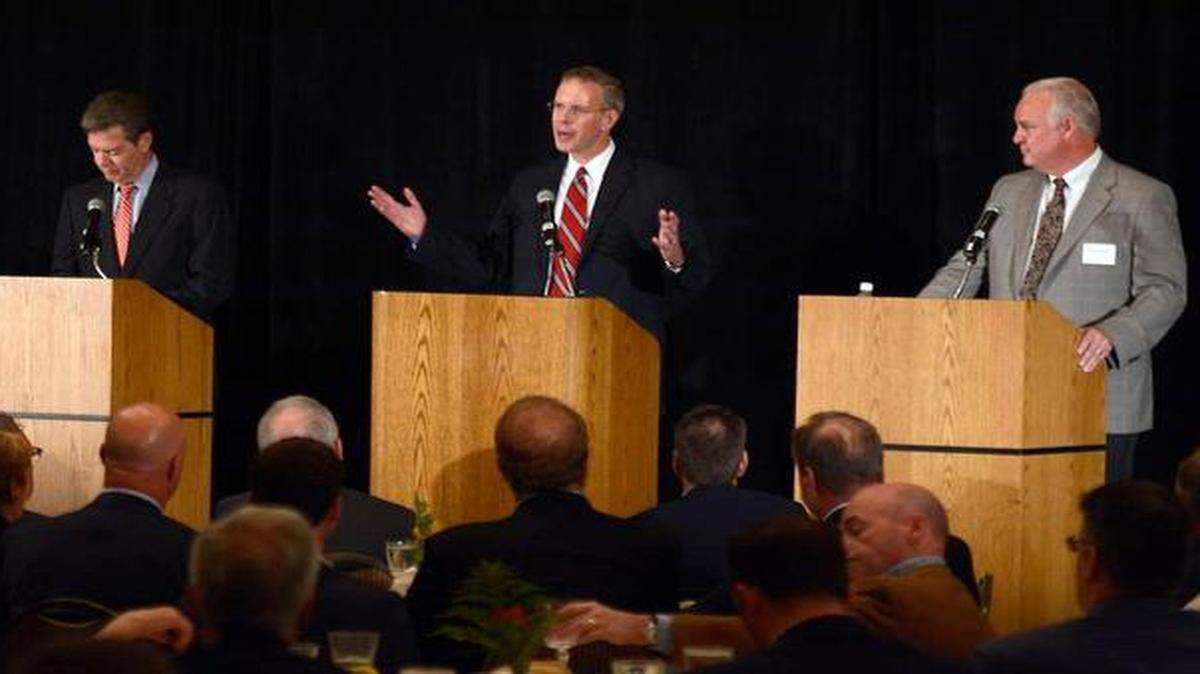 
Paul Davis (center) spoke Friday during a debate in Overland Park with Kansas Gov. Sam Brownback (left) and Keen Umbehr.
