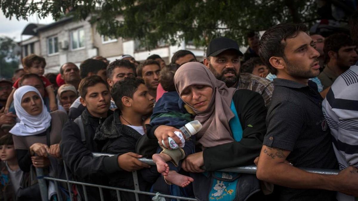 
Syrian refugees waited to be registered by police in the southern Serbian town of Presevo. 
