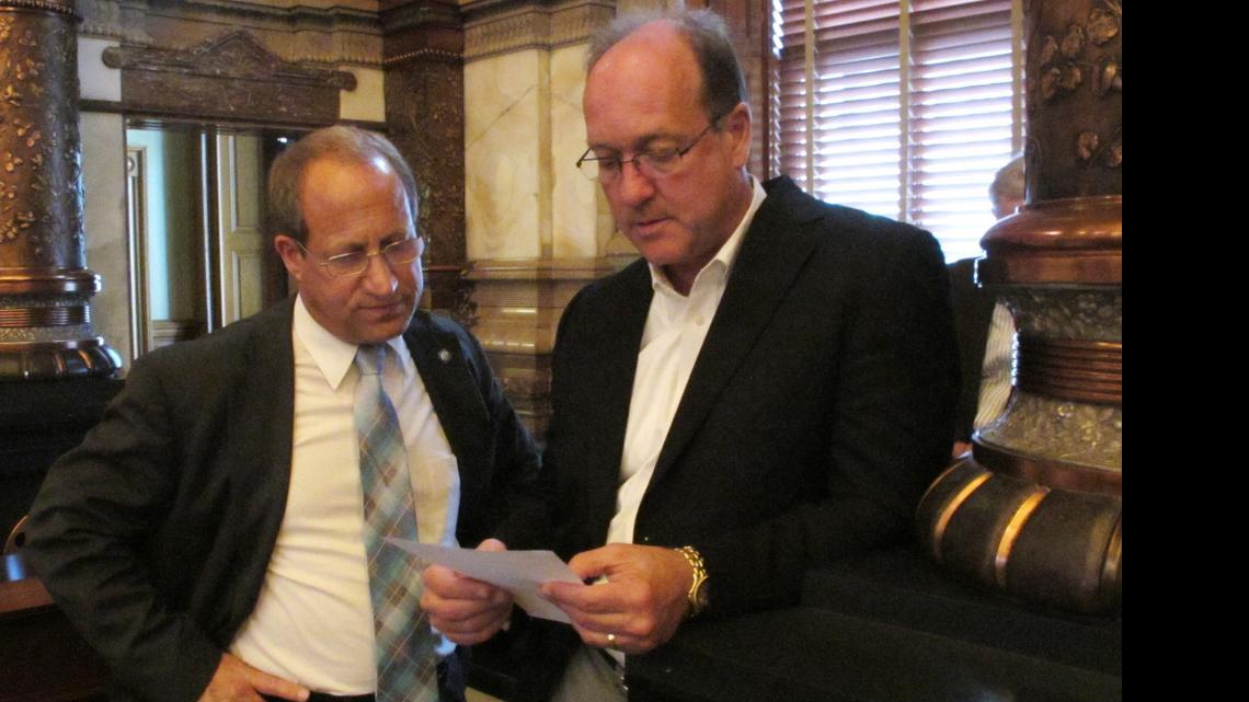 
Kansas state Sens. Forrest Knox of Altoona (left) and Jeff Longbine of Emporia on Sunday discussed a tax increase plan that the chamber passed. 
