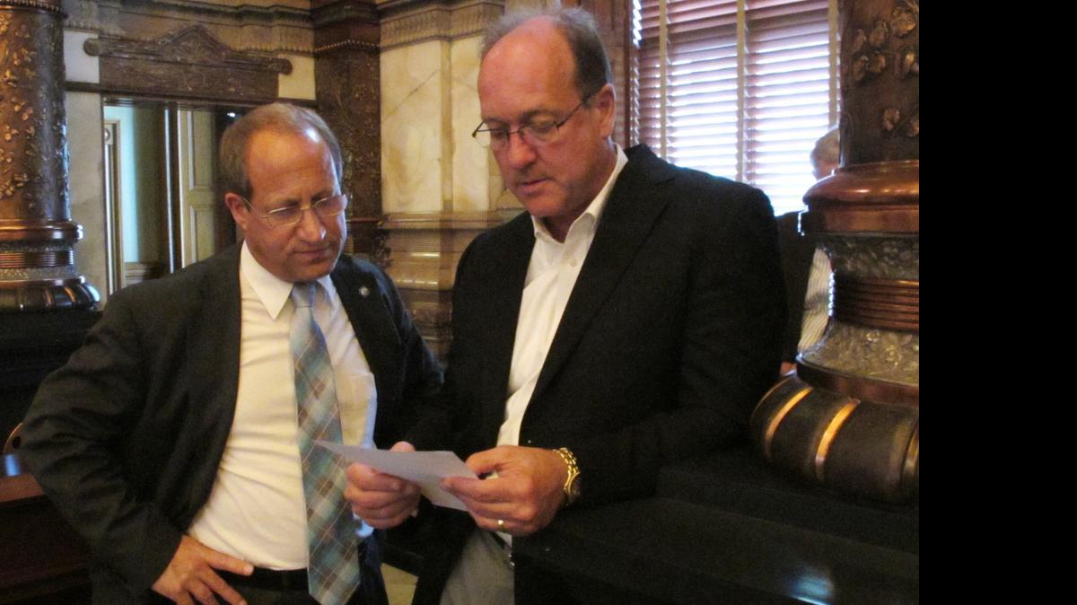 
Kansas state Sens. Forrest Knox of Altoona (left) and Jeff Longbine of Emporia on Sunday discussed a tax increase plan that the chamber passed. 
