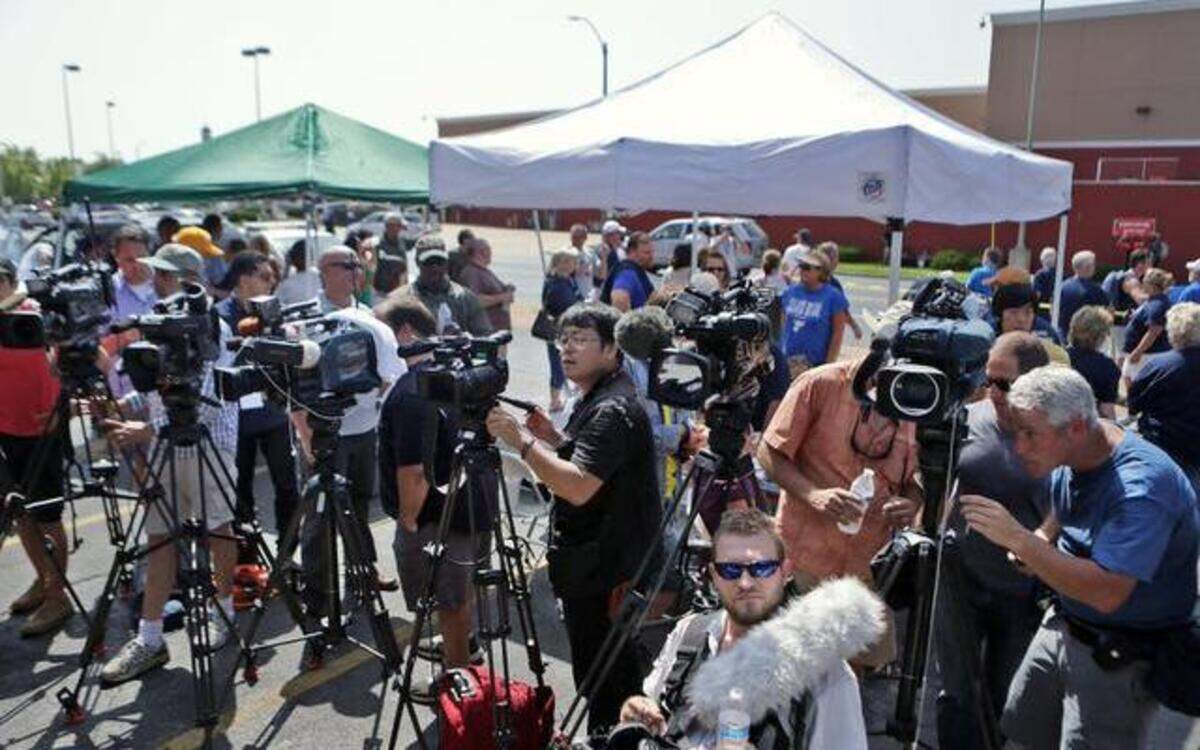 
News media from all over the world cover a rally for Ferguson police officer Darren Wilson on Saturday at a bar in St. Louis.
