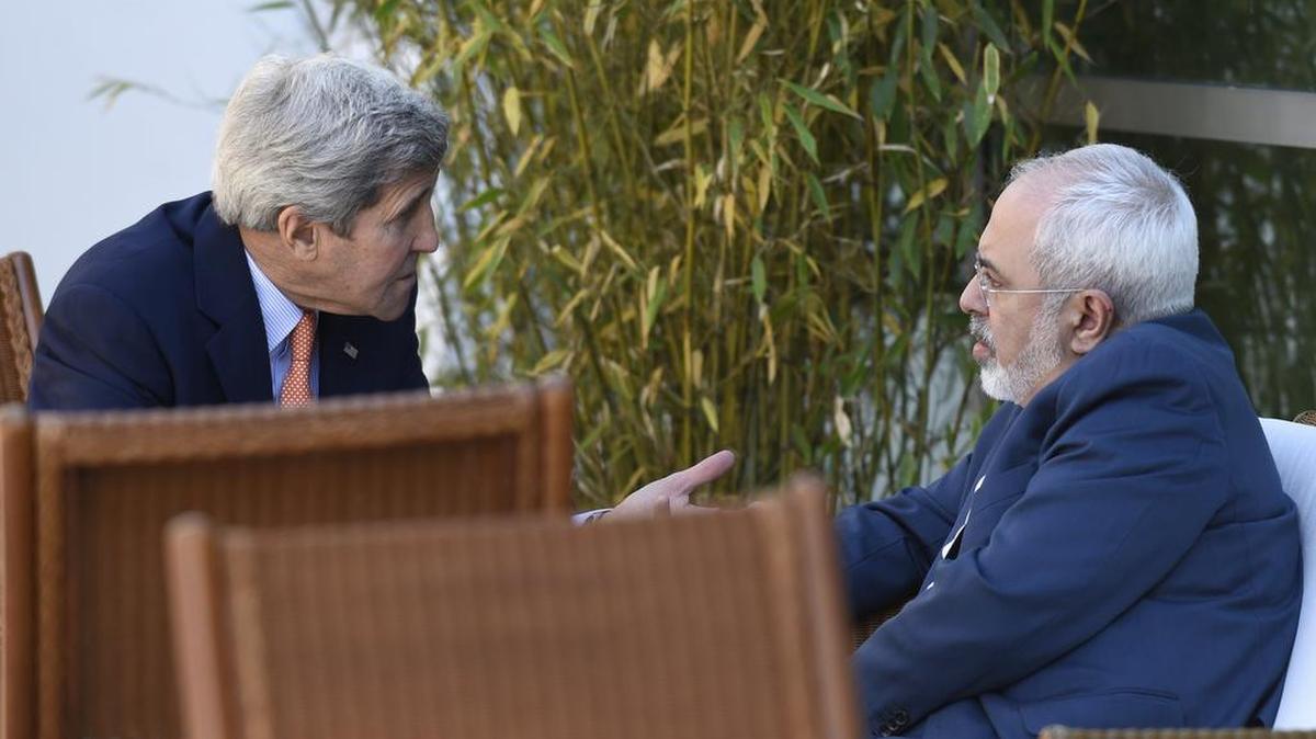 
U.S. Secretary of State John Kerry (left) huddled in May with Iranian Foreign Minister Mohammad Javad Zarif in Geneva, Switzerland, during negotiations over a final agreement on Iran’s nuclear capability and economic sanctions.

