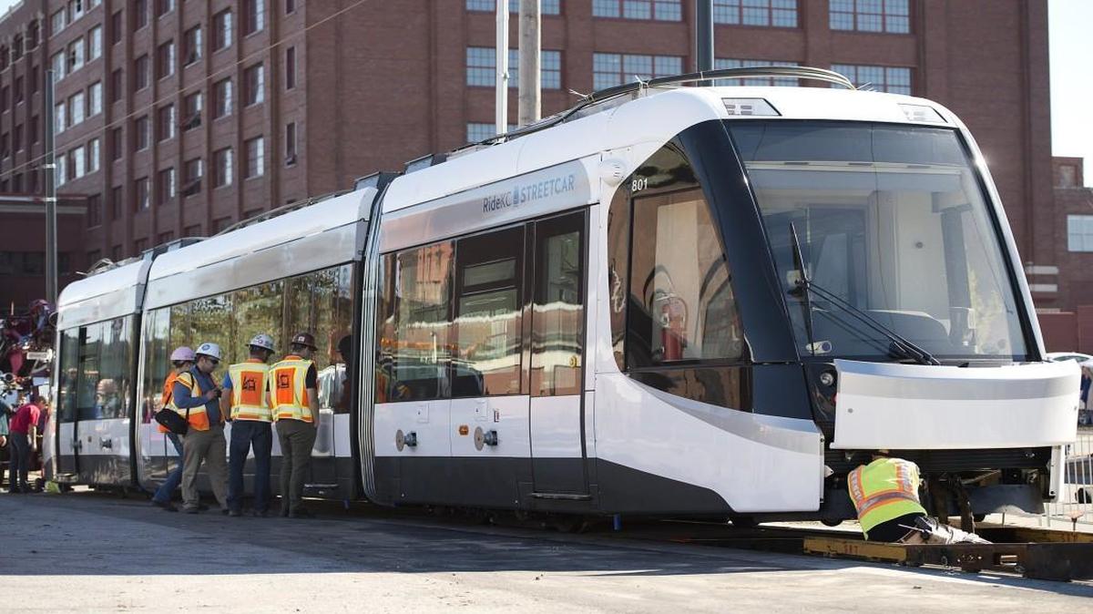 Workers looked over Kansas City’s new streetcar after it arrived Monday, prompting boosters to become more confident that the entire two-mile system will be operating sometime in early 2016.