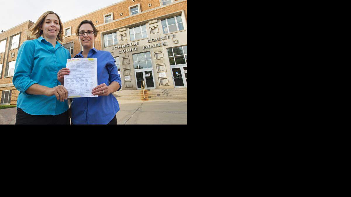 
Angela Schaefer (left) and longtime partner Jennifer Schaefer got an application for a marriage license at the Johnson County Courthouse in Olathe.
