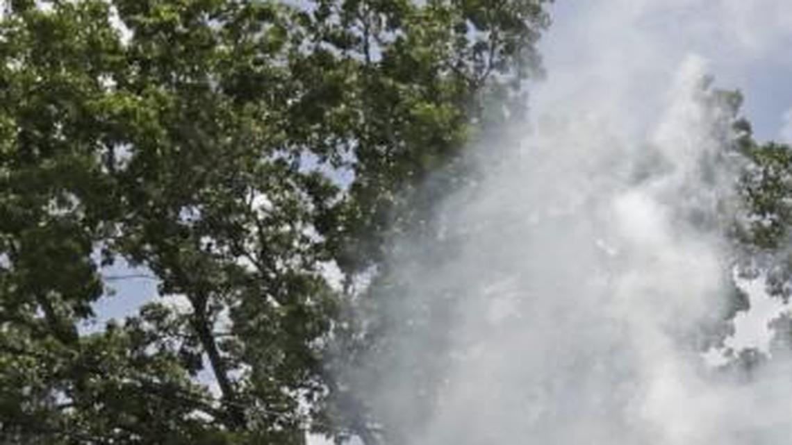 A Miami-Dade County mosquito control worker sprays around a home in the Wynwood area of Miami this month. The Centers for Disease Control and Prevention has issued a new advisory that says pregnant women should not travel a Zika-stricken part of Miami, and pregnant women who live there should take steps to prevent mosquito bites and sexual spread of the virus.
