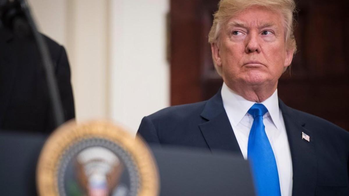 President Trump listens during the unveiling of legislation that would place new limits on legal immigration at the White House on Wednesday.
