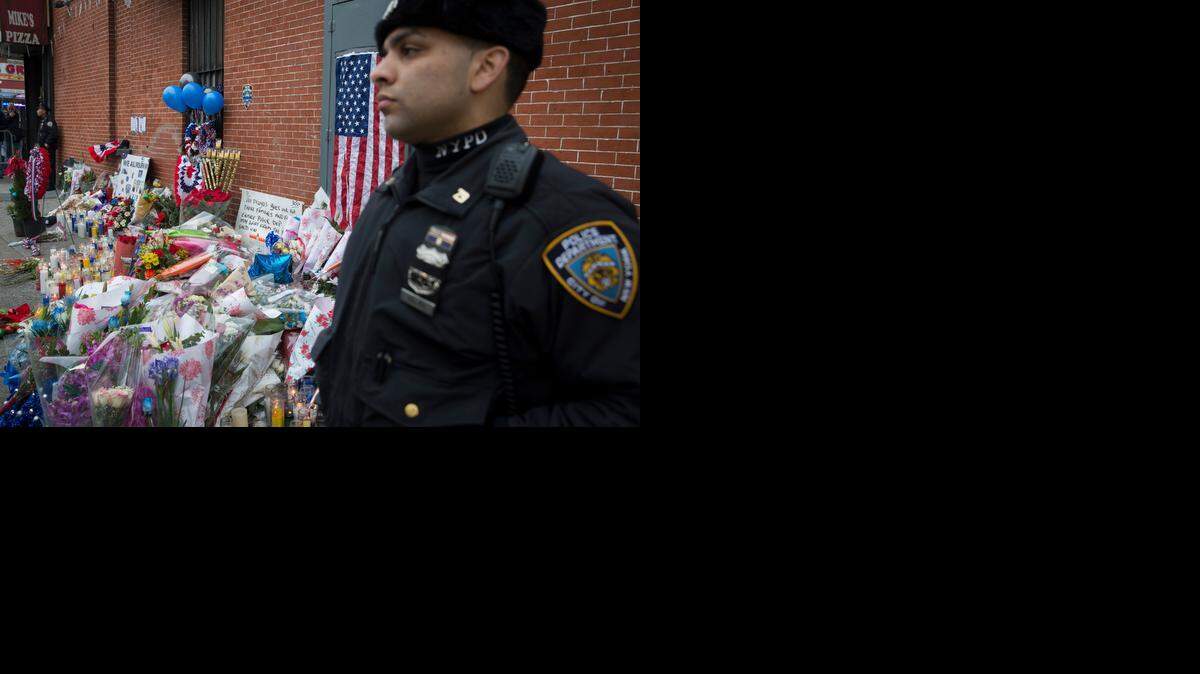 
New York grieves for slain officers.
