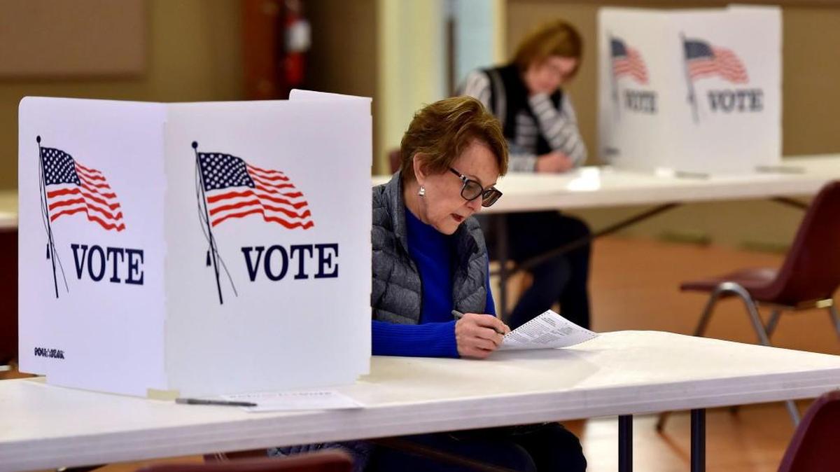 Voters including Peggy Sample (foreground) cast their ballots on Tuesday, April 4, 2017, at the Harmony Vineyard church in the Northland.