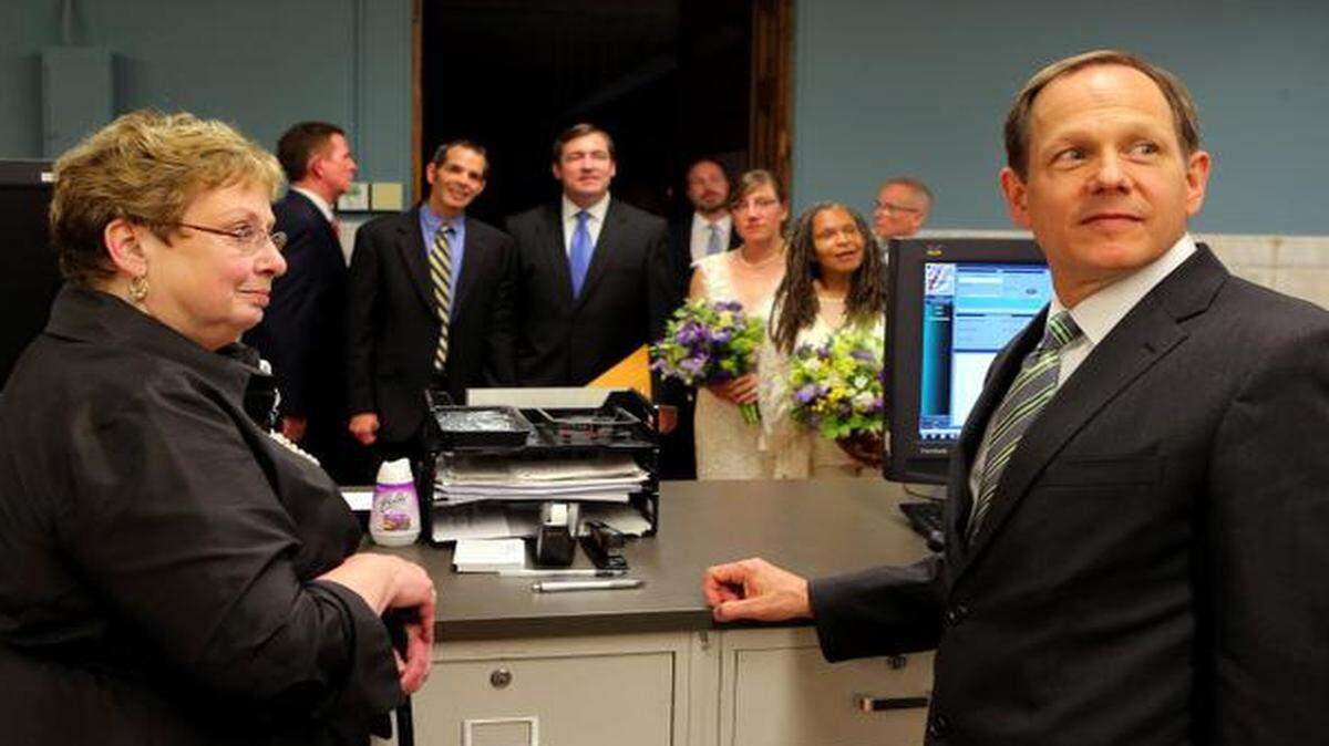 
St. Louis recorder of deeds Sharon Quigley Carpenter and Mayor Francis Slay waited for information on marriage licenses to be entered into the computer after four same-sex couples were married at City Hall. 
