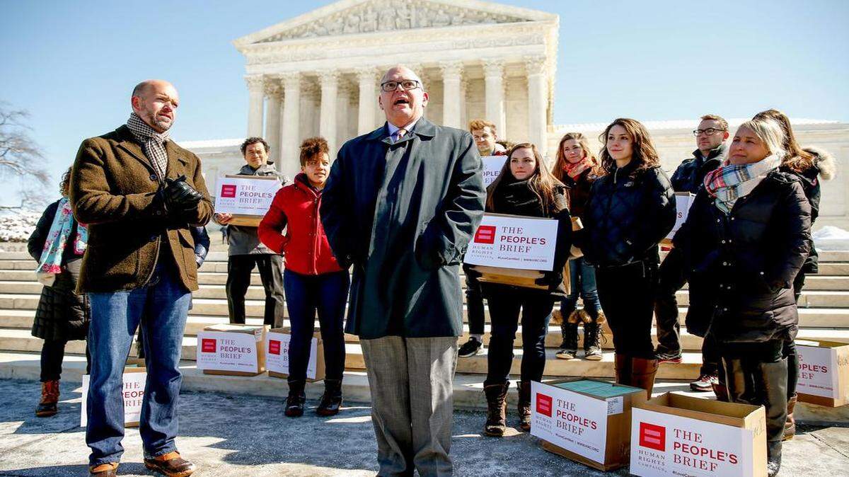 
Jim Obergefell (center) is the named plaintiff in a marriage equality case to be heard by the U.S. Supreme Court on Tuesday. 
