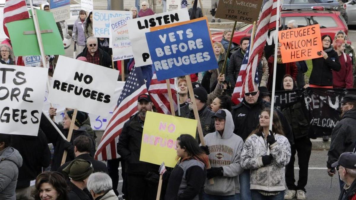Emotions are running high over calls to restrict admission of Syrian refugees. Protesters on both sides make their case outside of the Washington state Capitol.