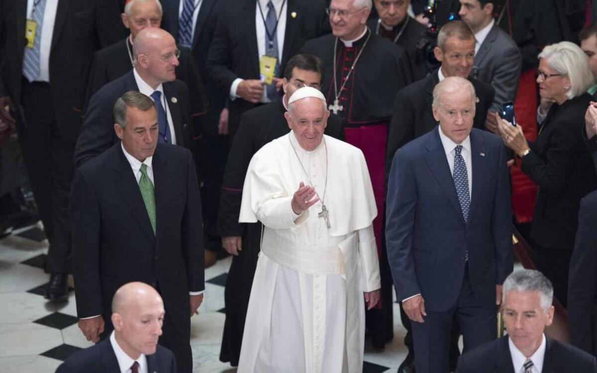 
After addressing a joint meeting of Congress, Pope Francis was escorted by House Speaker John Boehner (left) and Vice President Joe Biden.
