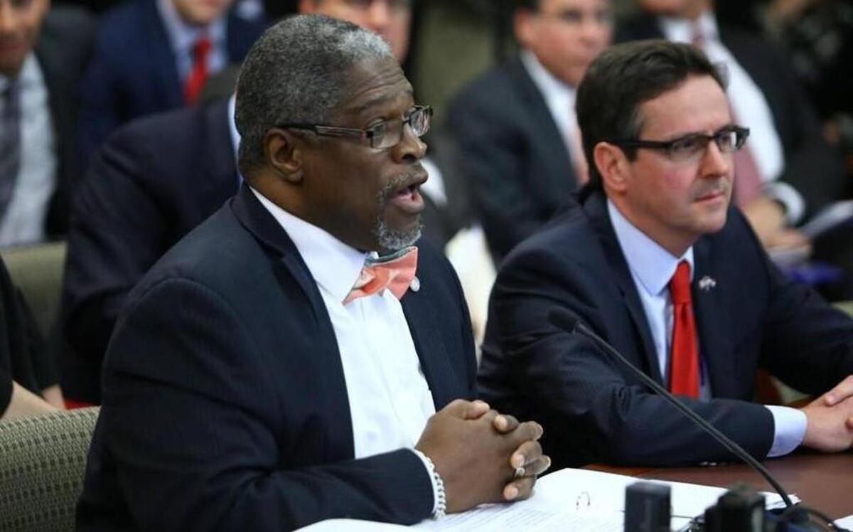 At a Missouri Senate committee meeting Thursday, Mayor Sly James of Kansas City (left) gave good reasons to retain the earnings tax while tax foe Sen. Kurt Schaefer listened.