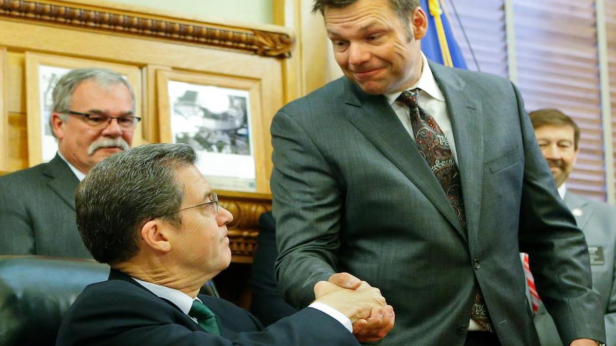 
Gov. Sam Brownback (left) this week unfortunately opened the door for Secretary of State Kris Kobach (right) to ramp up his harassment of Kansas voters.
