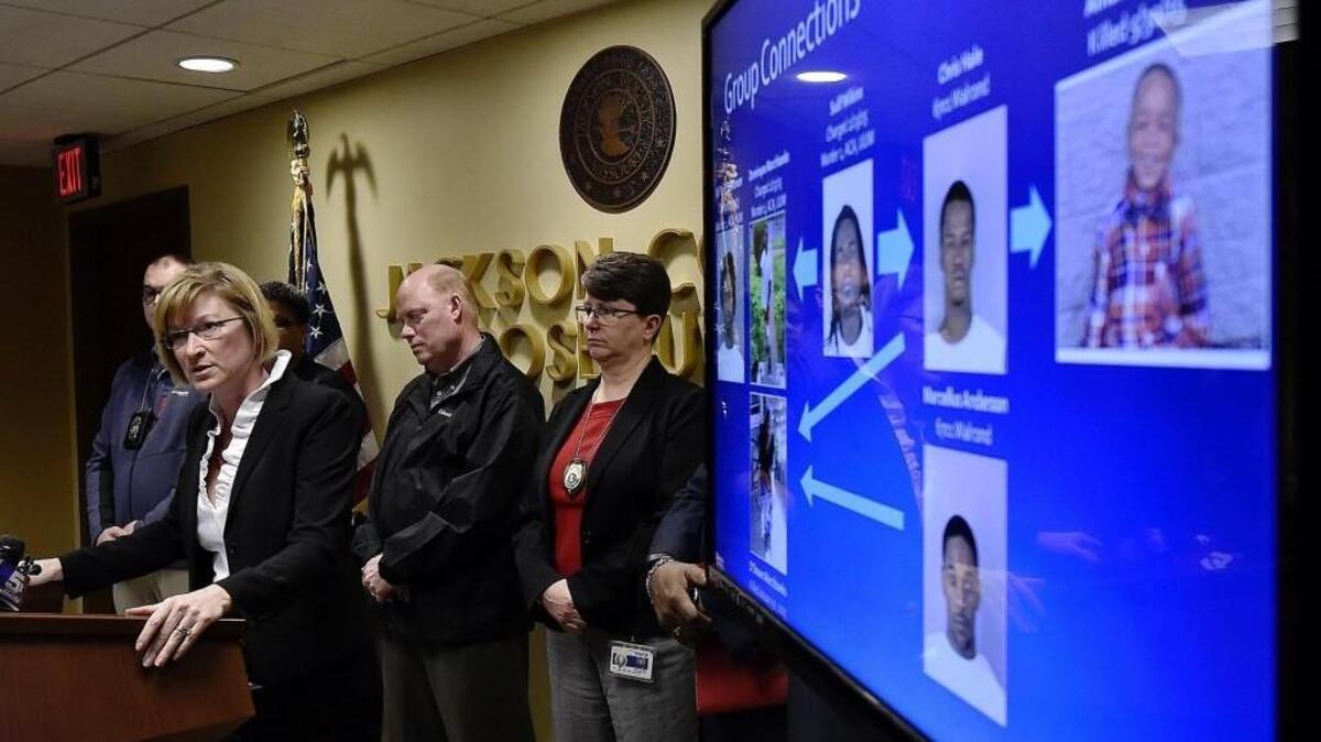 Jackson County Prosecutor Jean Peters Baker, at podium, explains how retaliation is thought to have caused the death of 3-year-old Amorian Hale.
