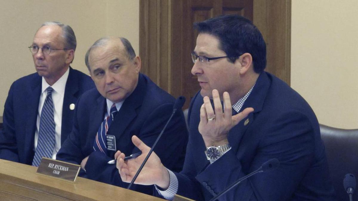 Kansas lawmakers wrangle over school funding issues. From left are Marvin Kleeb, R-Overland Park, Jerry Henry, D-Atchison, and ron Ryckman, R-Olathe.