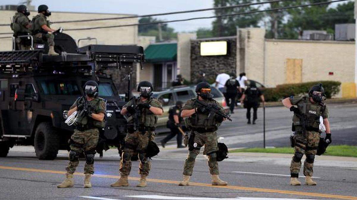 
Police must protect the public, but with the least show of force required. 

