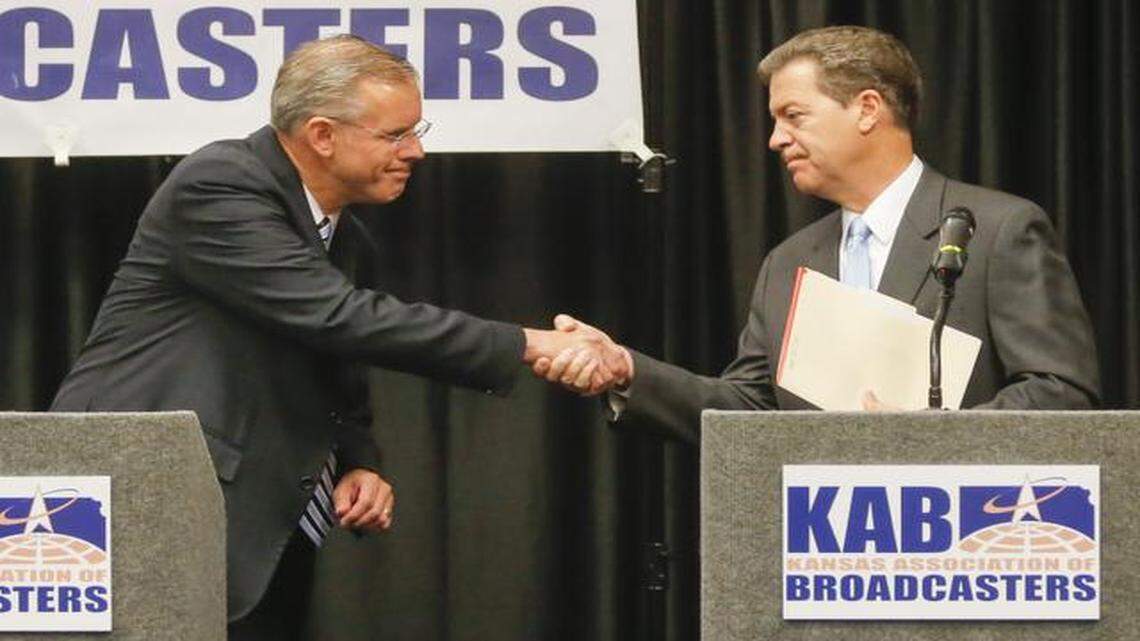 
Kansas gubernatorial candidates Paul Davis (left) and Sam Brownback debated each other Tuesday in Wichita.
