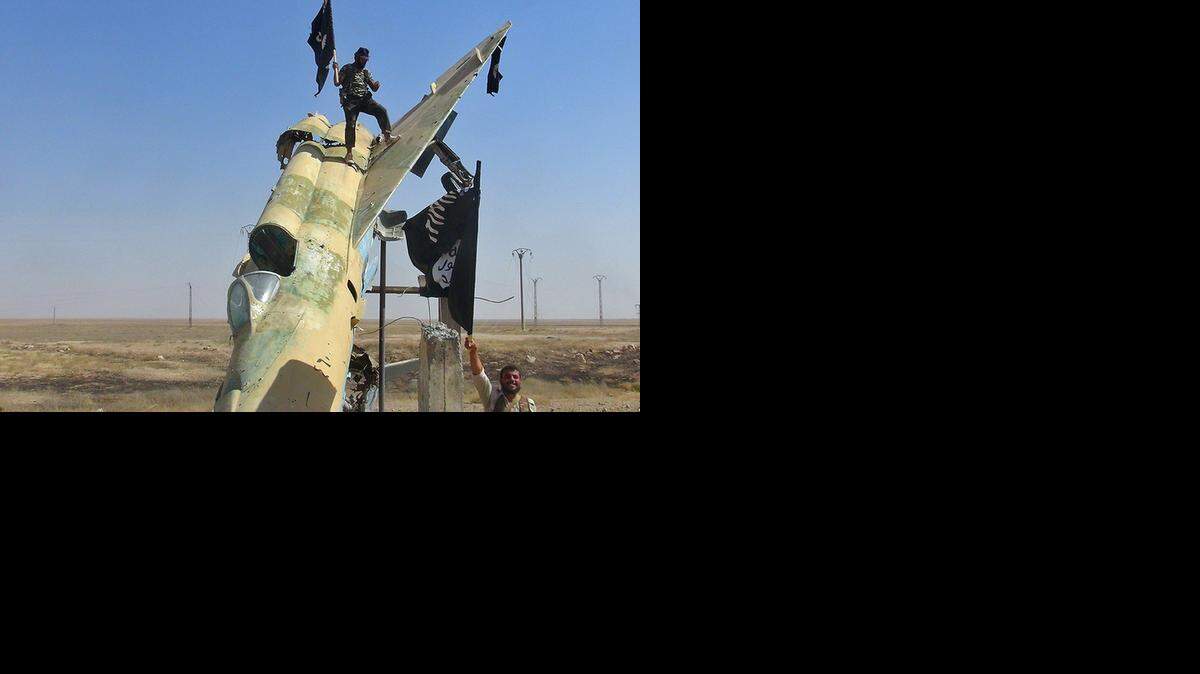 
The Islamic State media operation posted this image of fighters after its forces took over the Syrian government’s Tabqa air base in Raqqa, Syria.
