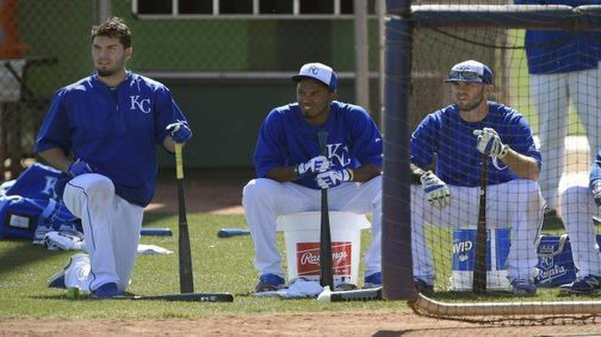 
Eric Hosmer, Alcides Escobar, Mike Moustakas and Omar Infante waited their turn to hit during Friday’s spring training workout for the Royals in Surprise, Ariz.
