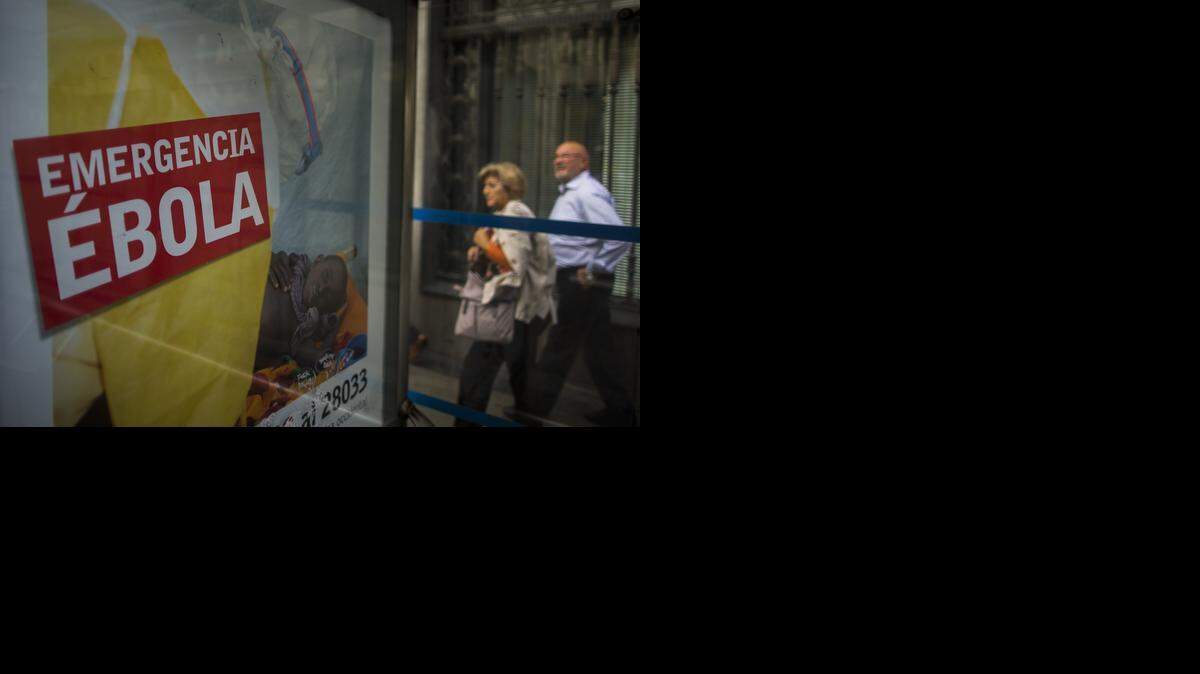 
An advertising sign calls for financial help to fight Ebola in Africa on Tuesday in Madrid, Spain. Three more people were placed under quarantine for Ebola at a Madrid hospital where a Spanish nurse became infected, authorities said.
