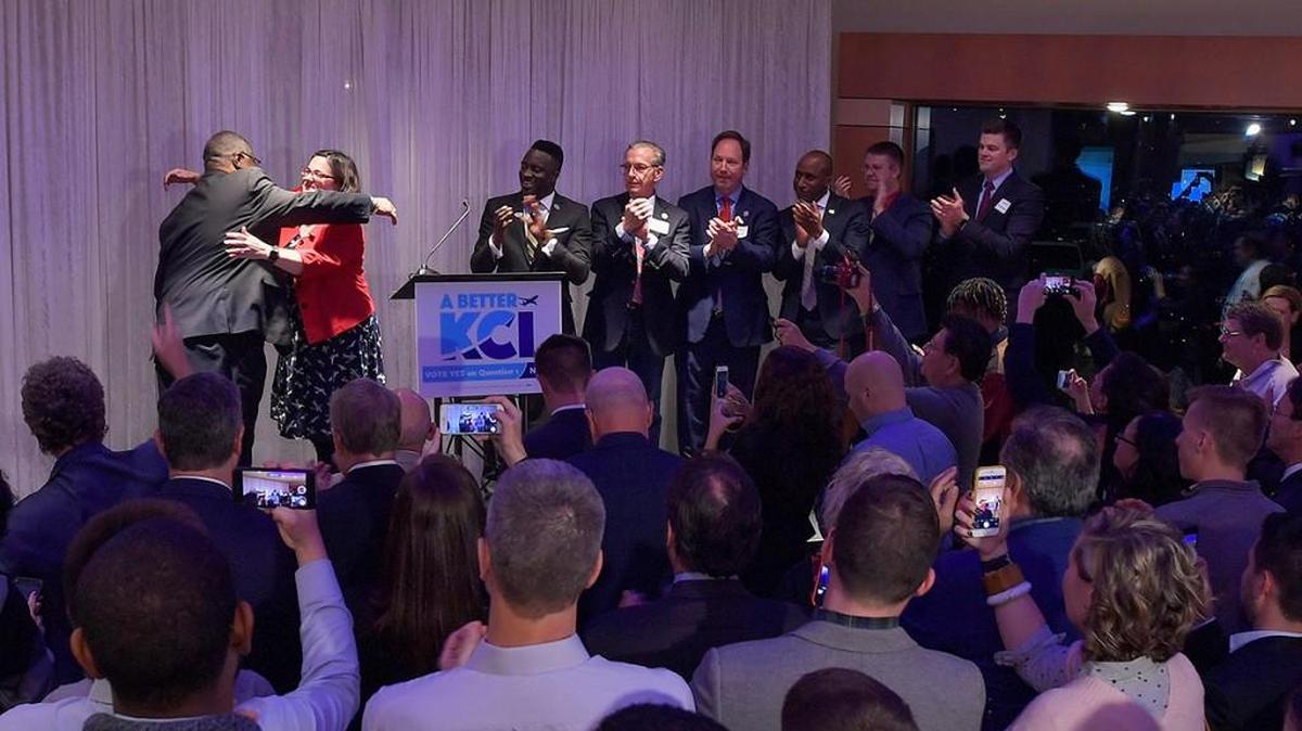 Mayor Sly James and council member Jolie Justus hug at the Kansas City International Airport vote watch party.