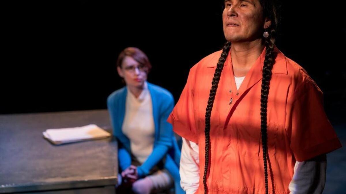In “Justice in the Embers” Moses Brings Plenty portrays defendant Bryan Sheppard, who has explored his Native American heritage while in prison. Amy Attaway, background, portrays Sheppard’s attorney, Cyndy Short.