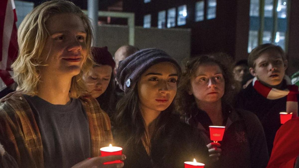 People in Lincoln, Neb., held a candlelight vigil for Syrian refugees as Gov. Pete Ricketts joined other Republican governors expressing concern over the federal screening of Syrian refugees who want to enter the United States.
