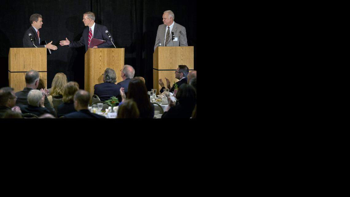 
Gov. Sam Brownback (left) and opponent Paul Davis disagree on how far income taxes should be cut in Kansas. 

