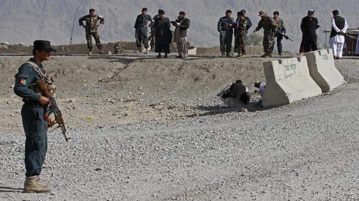 
An Afghan policeman stood guard after a bomb explosion in Kandahar province south of Kabul, Afghanistan, last week.

