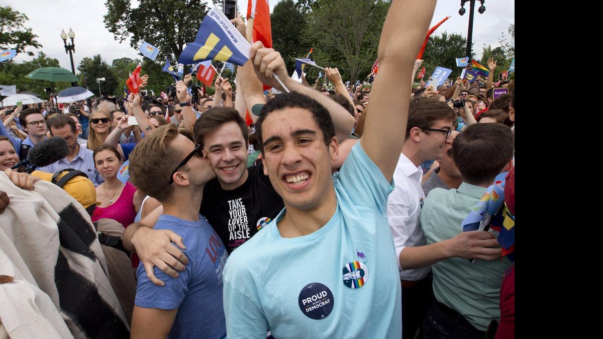
Supporters of same-sex marriage celebrate outside of the Supreme Court in Washington after news of the historic decision in favor of marriage equality.


