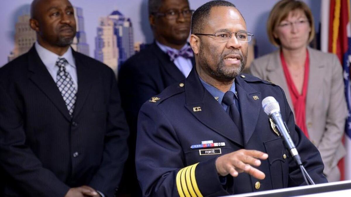 Kansas City Police Chief Darryl Forté, speaking at a news conference, is credited by many in building better police-community relations in Kansas City. Behind Forté are Kansas City Mayor Sly James (middle) and Jackson County Prosecutor Jean Peters.