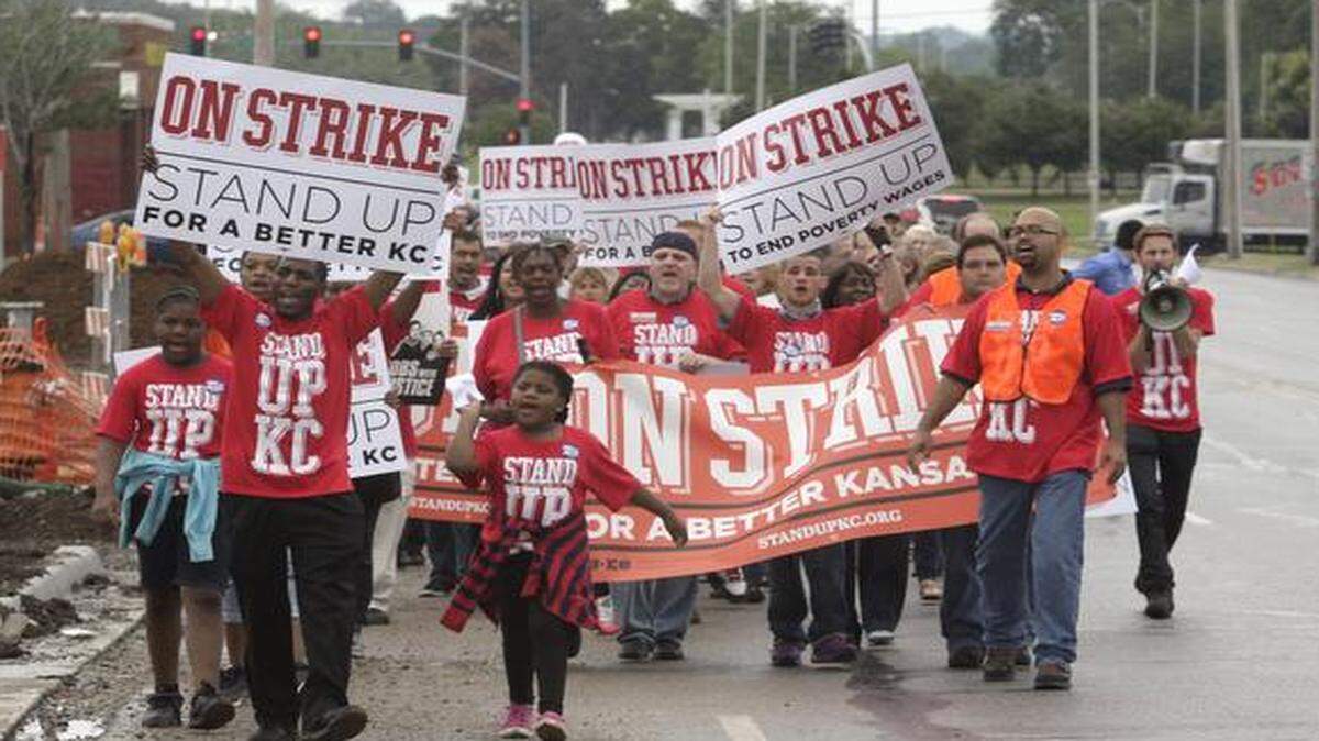 
About 160 people marched in a Kansas City rally in July 2013 in support of higher pay for fast-food workers. 
